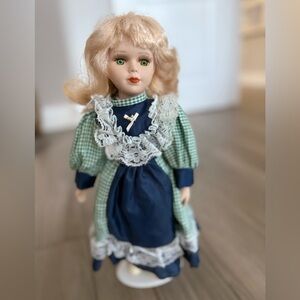 Classic Porcelain Doll with Green and Blue Dress